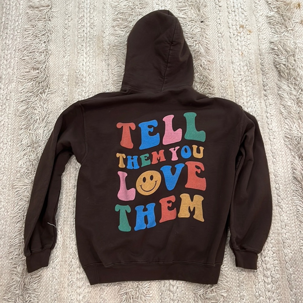 Brown hoodie size M quote on back